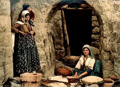 Lebanese women making bread in front of their house by Swiss Photographer